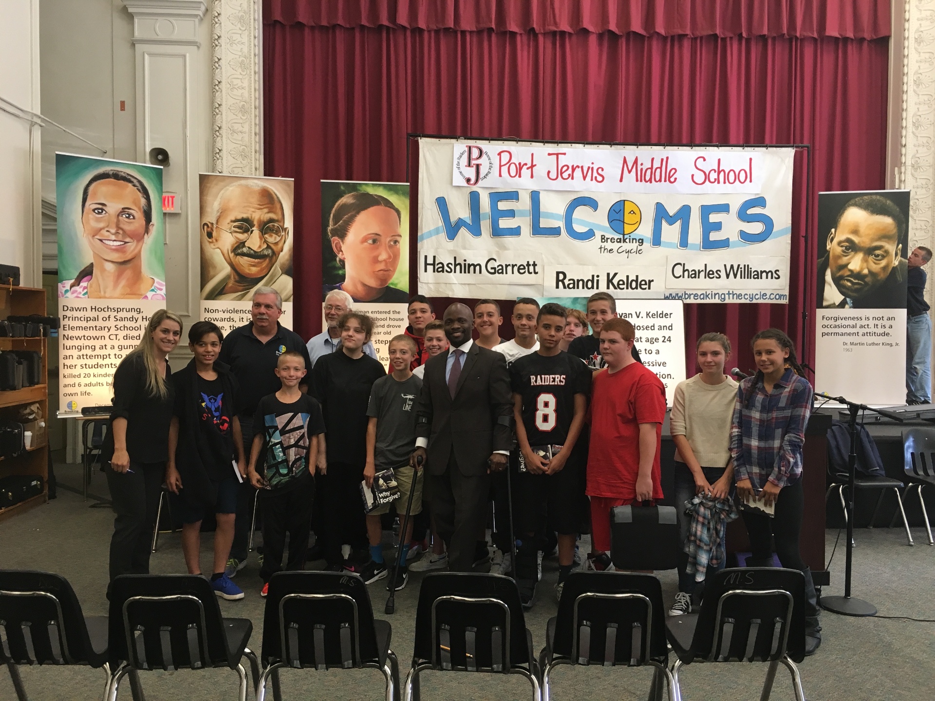 Hashim Garrett with students at Port Jervis Middle School